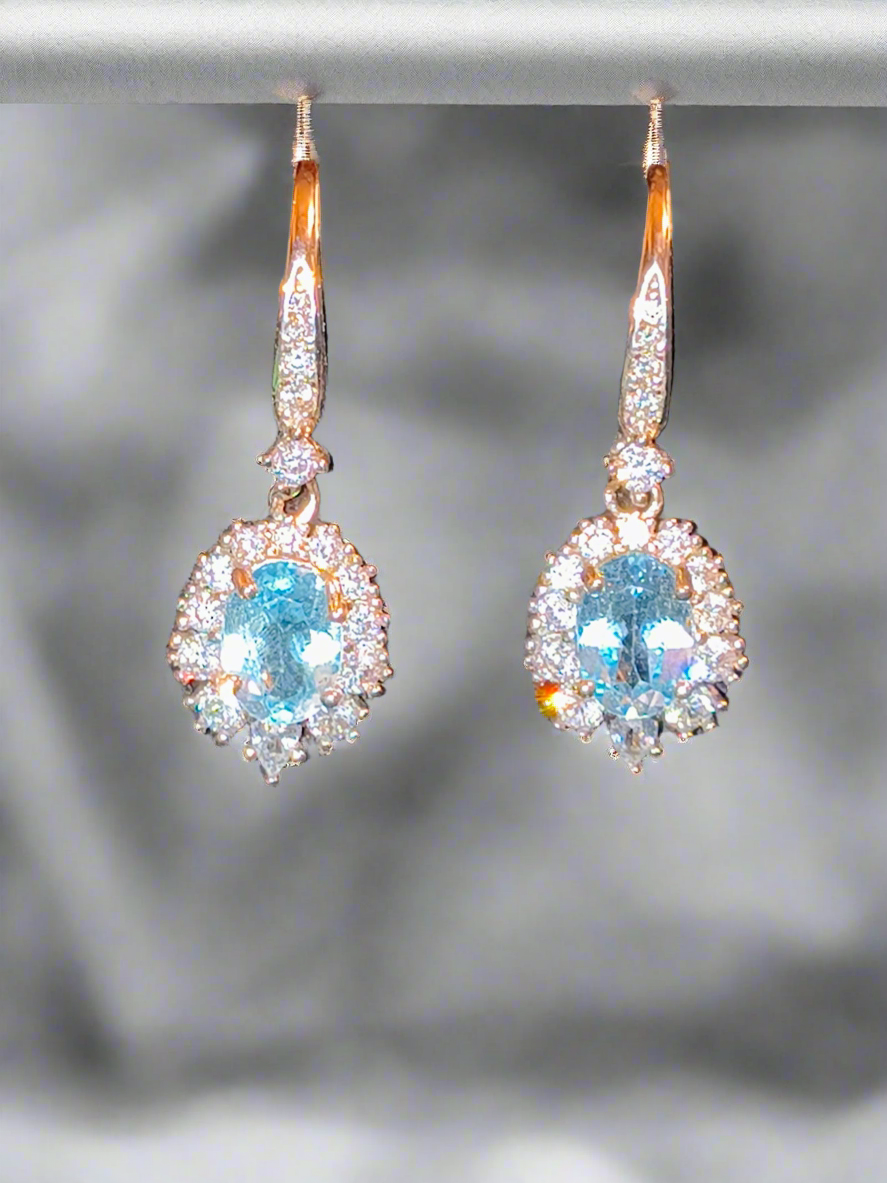 Pre mounted blue topaz earrings w/cz